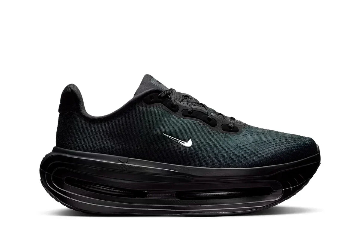 Nike Vomero Premium SP Black trainers featuring an all-black design and mini chrome Swoosh detailing